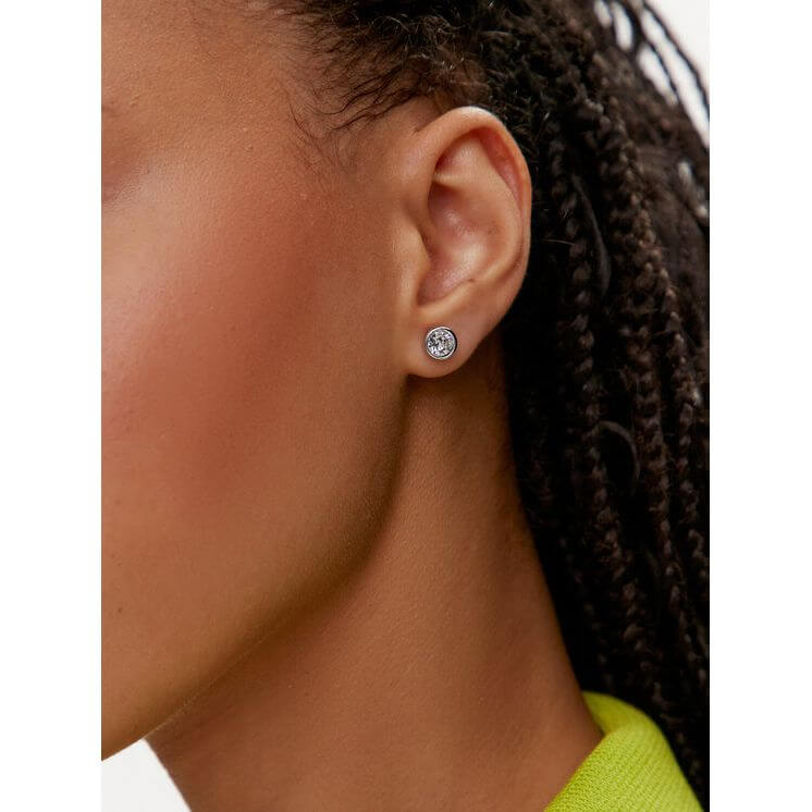 Swarovski Mod. 5696073 earrings in silver 925, featuring quartz analog movement, worn by a lady. Water resistant up to 5 ATM.