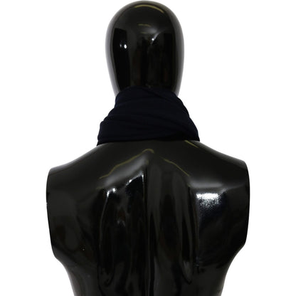 Dolce Gabbana blue wool scarf displayed on a mannequin from the back, showcasing its stylish wrap around the neck.