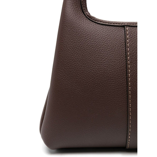 Close-up of coffee brown leather detail on Coach Lana 25 leather crossbody bag with visible stitching.