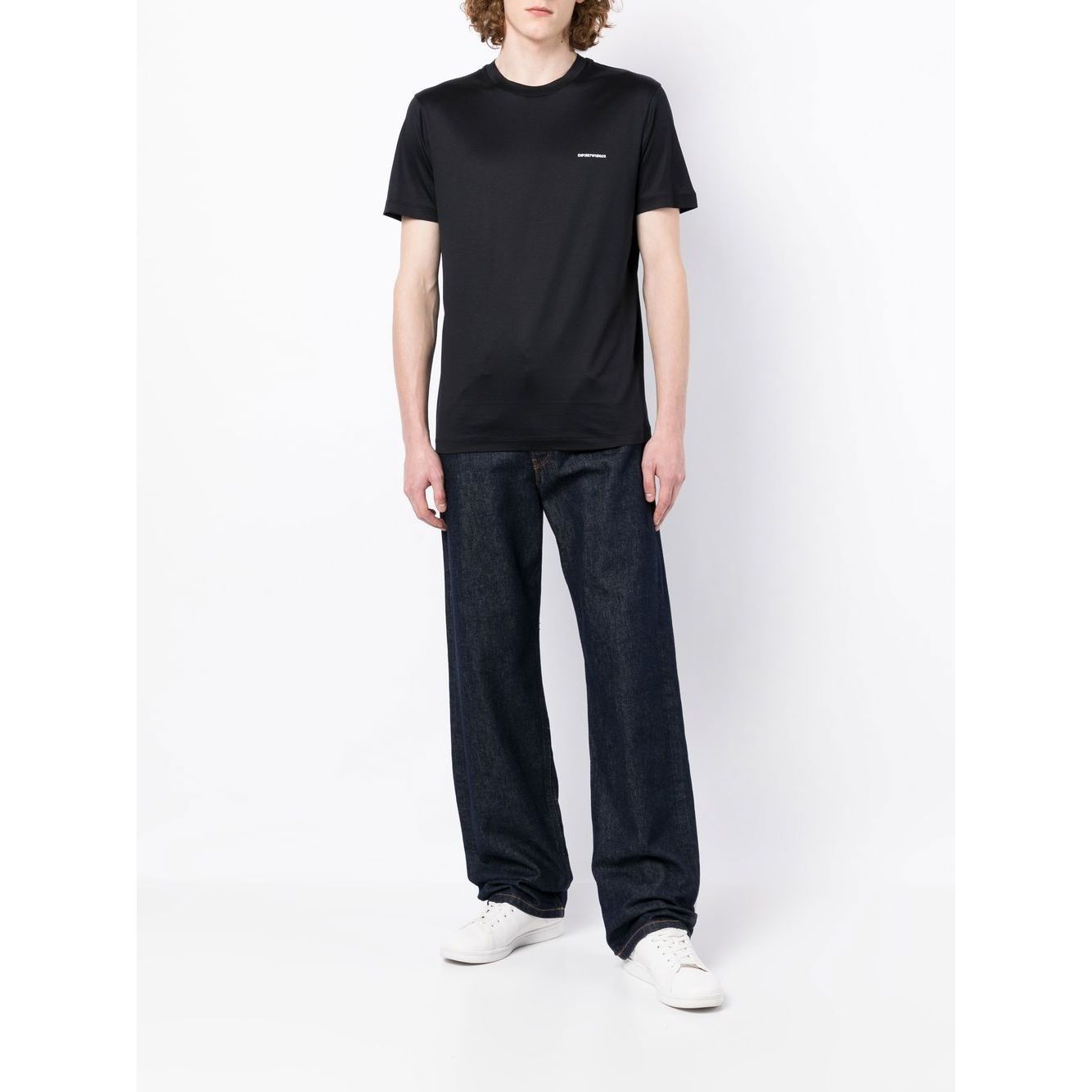 Model wearing Emporio Armani T-shirts and Polos Blue with logo print, crew neck, short sleeves, cotton blend, navy blue lyocell blend fabric.