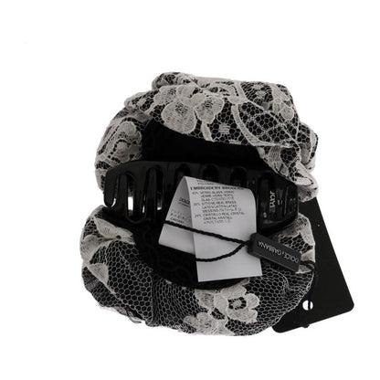 Dolce Gabbana floral lace hair claw featuring black and white floral design and crystal detailing.