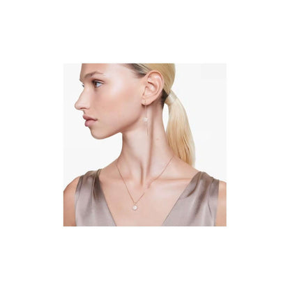 Woman wearing SWAROVSKI Mod. 5683451 silver 925° earrings with quartz analog movement, 38mm case, suitable for ladies.