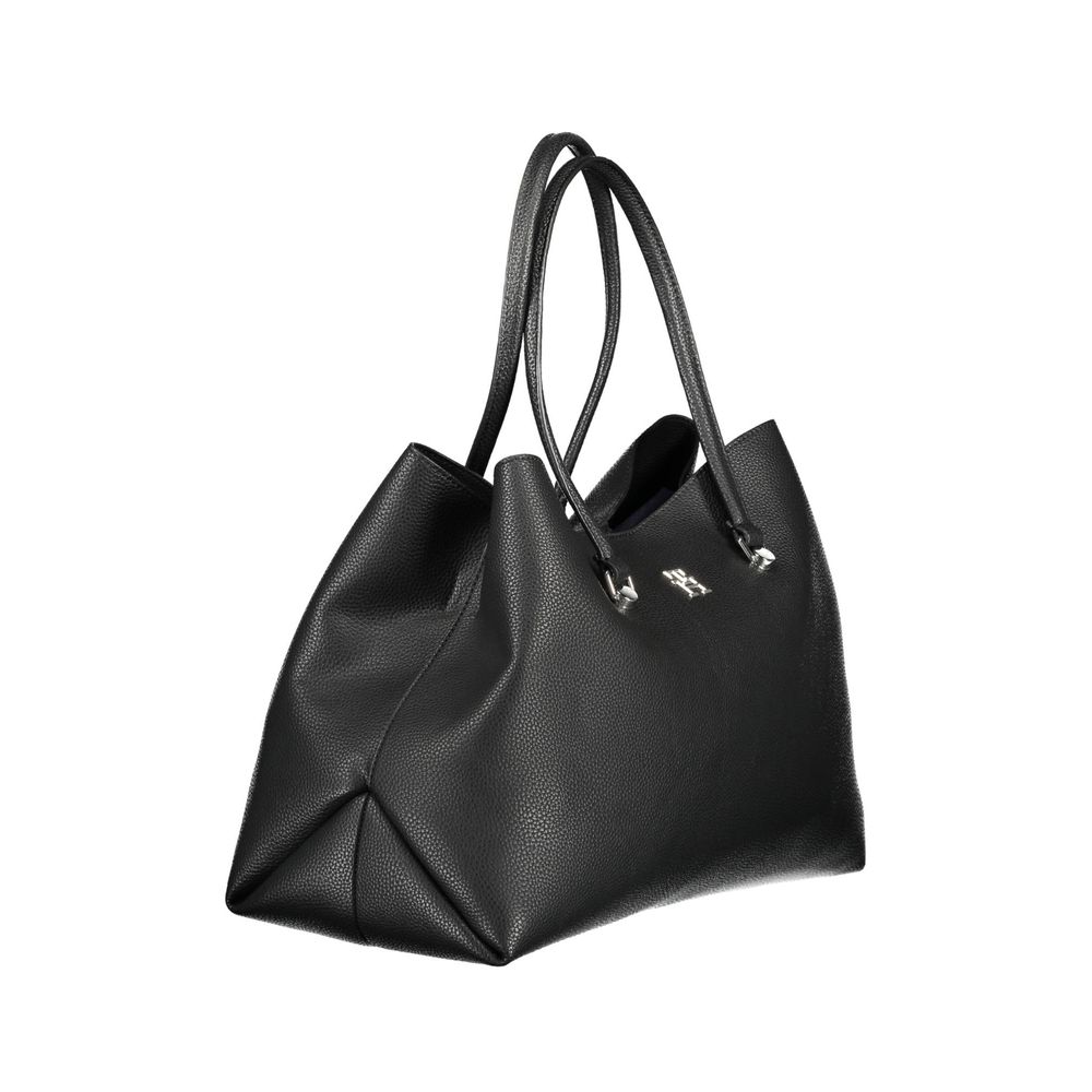 Front view with bag zipped and handles upright.