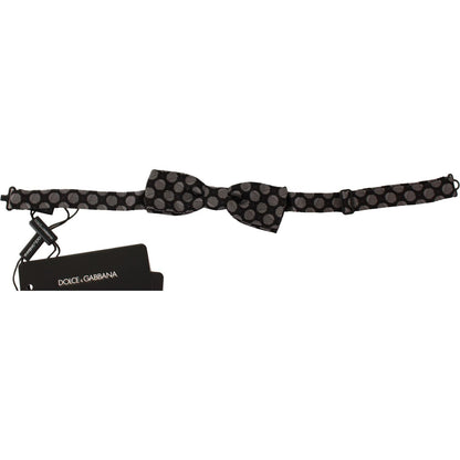 Dolce Gabbana silk polka dot bow tie in brown jacquard fabric, featuring adjustable length neck strap and brand tags.