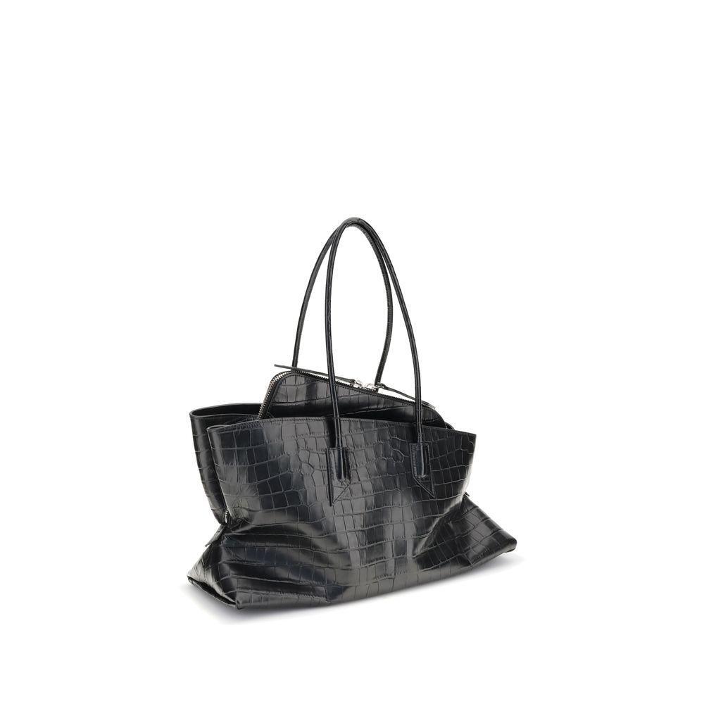 Front view with bag zipped and handles upright.