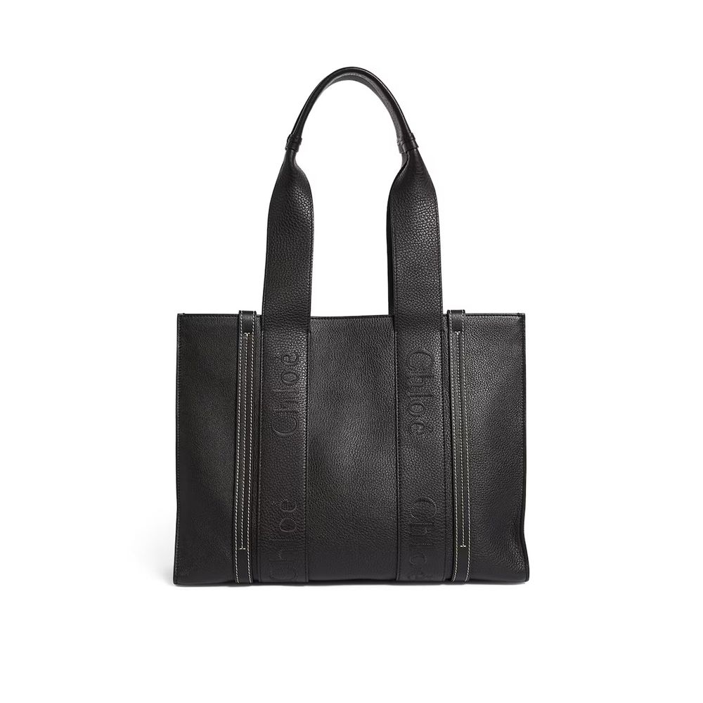 Front view with bag zipped and handles upright.