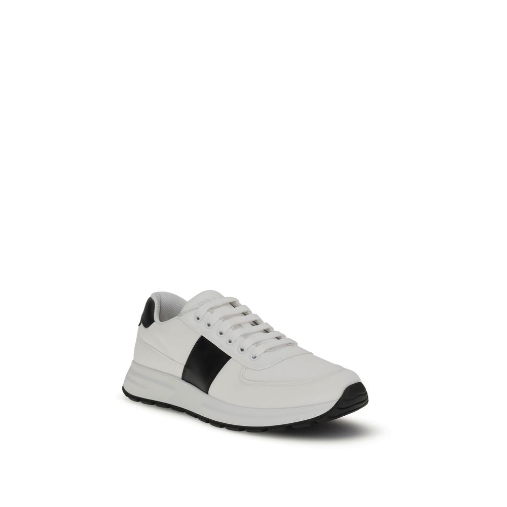 Prada Leather Sneakers in two-tone design with lace-up closure, featuring reinforced toe and iconic logo, made in Italy.