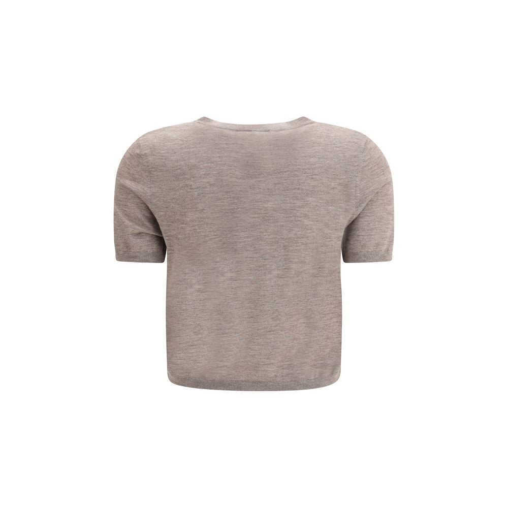 Back view of Lisa Yang Charlotte Cardigan in beige, featuring short sleeves and ribbed design, perfect for a modern, versatile look.