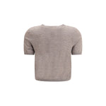Back view of Lisa Yang Charlotte Cardigan in beige, featuring short sleeves and ribbed design, perfect for a modern, versatile look.