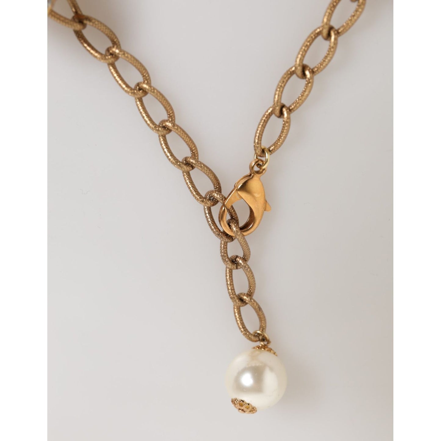 Dolce & Gabbana Gold Brass Faux Pearl Crystal Statement Luxury Jewelry Necklace with lobster clasp and faux pearl detail.