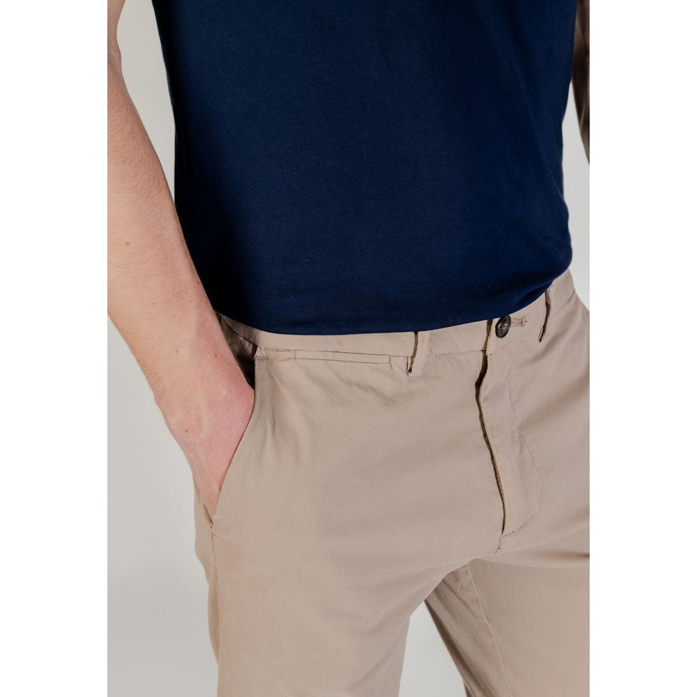 Man wearing Borghese Beige Cotton Skinny Pants with a navy shirt
