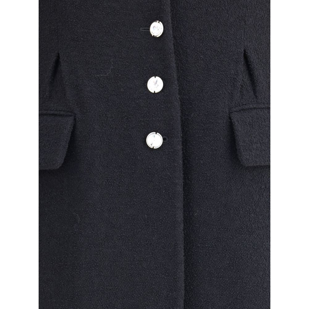 Close-up of Alessandra Rich Black Fleece Wool Coat with jeweled buttons and flap welts pockets, showcasing elegant and timeless design.
