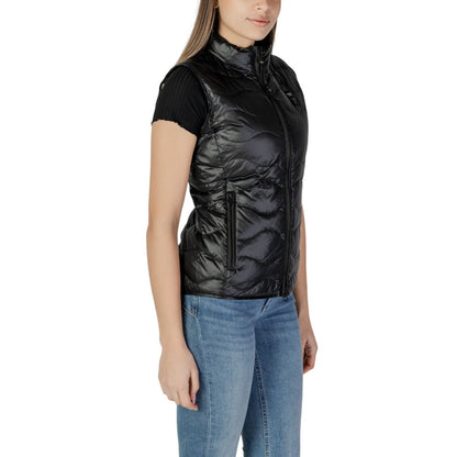 Woman wearing Blauer Black Polyamide Sleveless Jacket with wavy quilting and front zip closure, perfect for all seasons.