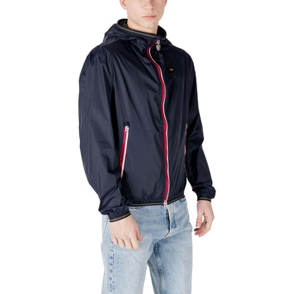 Man wearing Blauer Blue Polyamide Shell Jacket with front zip closure and side zip pockets, showcasing sporty design and Blauer branding.