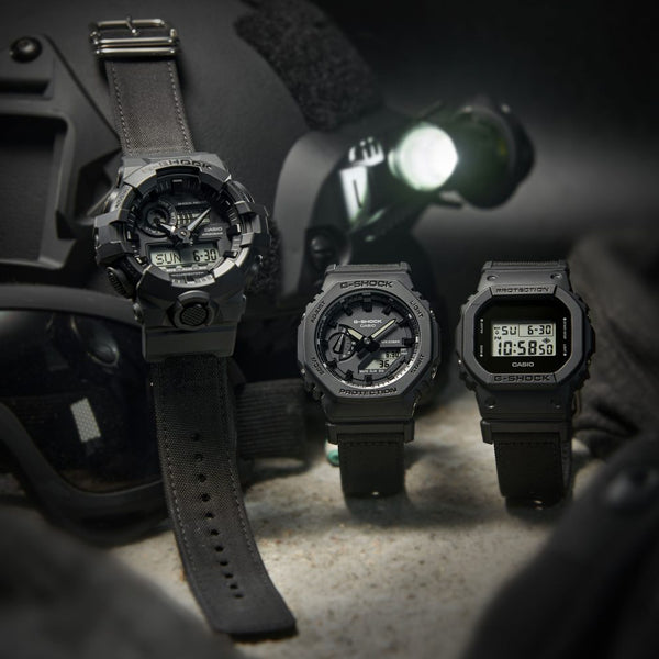 Alt Tag: CASIO G-SHOCK Mod. BOLD - BLACK CORDURA ECO FABRIC STRAP SERIE wristwatch on display with tactical gear, 20 ATM water resistance