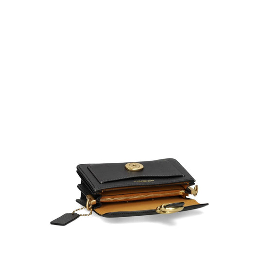 Coach Tabby 20 leather crossbody bag with open view showing internal sections, snap closure, and removable shoulder strap