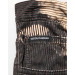 Dolce & Gabbana Beige Black Corduroy Tie-Dye Cotton Blend Pants close-up, featuring logo and unique tie-dye pattern.