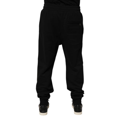 Rear view of Dolce & Gabbana Black Cotton Drawstring Logo Sweatpants Pants with Milano Italia logo patch.