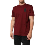 Dolce & Gabbana Bordeaux Red Cotton Crest Logo Patch T-Shirt with black embroidered crest on a male model.