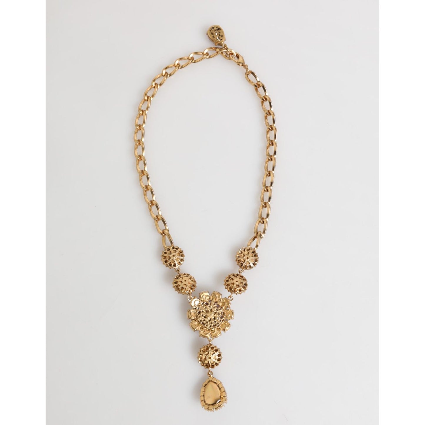 Dolce & Gabbana Gold Brass Crystal Pearl Purple Floral Pendant Jewelry Necklace on display.