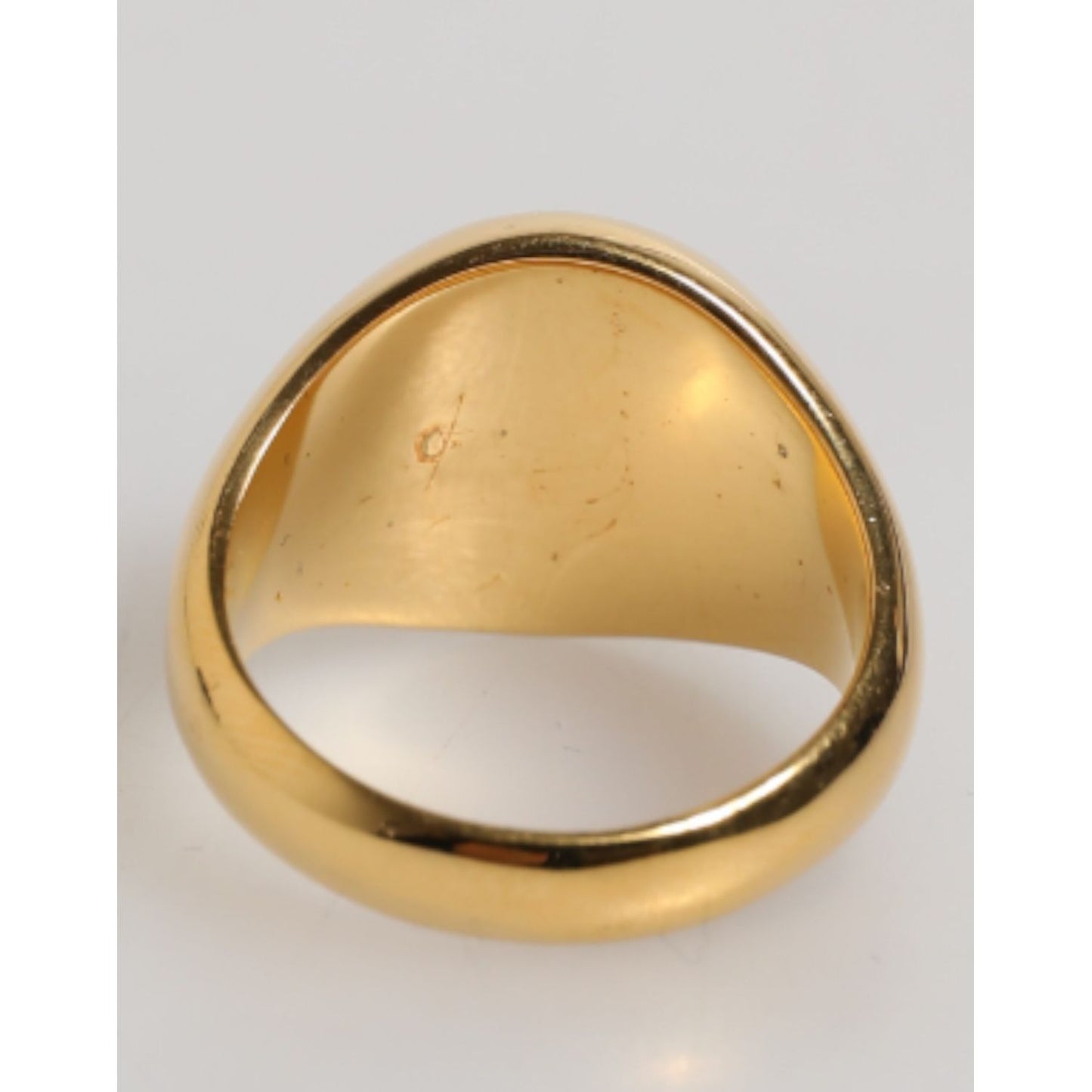 Dolce & Gabbana Gold Tone Real Brass Round Red DG Logo Men Ring showcasing gold-tone underside view.