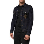 Man wearing Dolce & Gabbana Indigo Blue Denim Slim Fit Logo Patch Jacket with contrast stitching and DG logo patch embroidery.