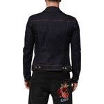 Back view of model wearing Dolce & Gabbana Indigo Blue Denim Slim Fit Logo Patch Jacket with contrast stitching.