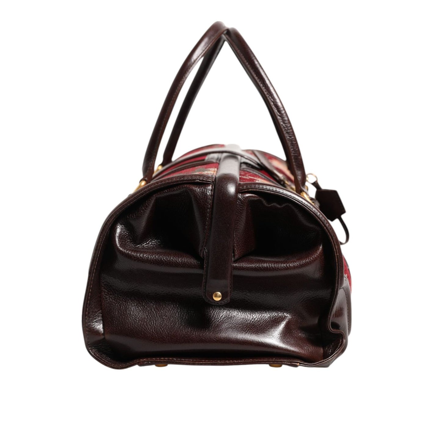 Side view of Dolce & Gabbana Multicolor Leather Jacquard Velvet Travel Duffle Bag with leather handle and metal hardware.