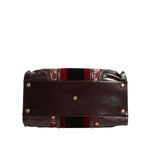 Bottom view of Dolce & Gabbana Multicolor Leather Jacquard Velvet Travel Duffle Bag with metal hardware details.