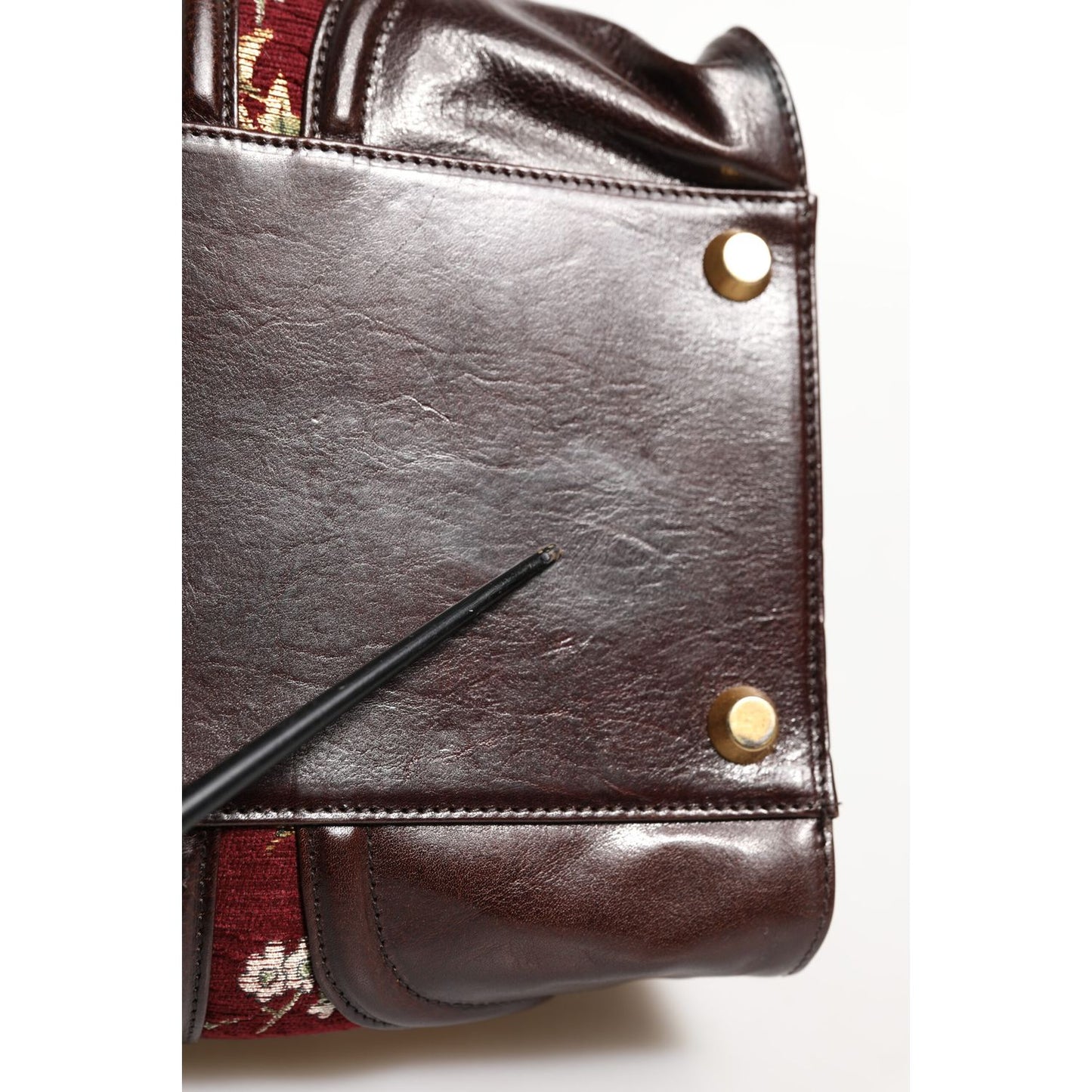 Detail of minor defect on the leather of Dolce & Gabbana Multicolor Leather Jacquard Velvet Travel Duffle Bag