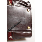 Detail of minor defect on the leather of Dolce & Gabbana Multicolor Leather Jacquard Velvet Travel Duffle Bag