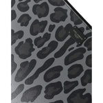 Close-up of Dolce & Gabbana Multicolor Leopard Jacquard Logo Plaque Document Briefcase Bag texture and logo plaque detail.