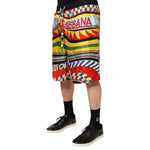 Dolce & Gabbana Multicolor Sicilian Carretto Shorts Swimwear with vibrant Sicilian Carretto print, worn by model.