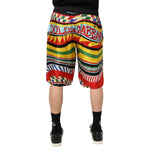 Back view of Dolce & Gabbana Multicolor Sicilian Carretto Shorts Swimwear with vibrant Sicilian Carretto print.