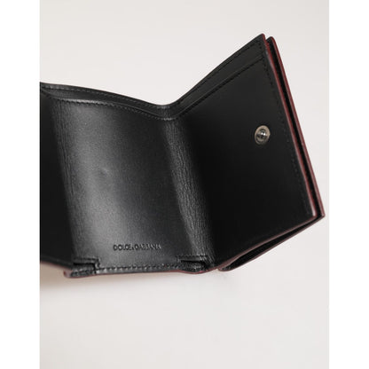Open view of Dolce & Gabbana Red Leather Bold Logo Print Trifold Card Holder Wallet interior, showcasing high-quality craftsmanship.