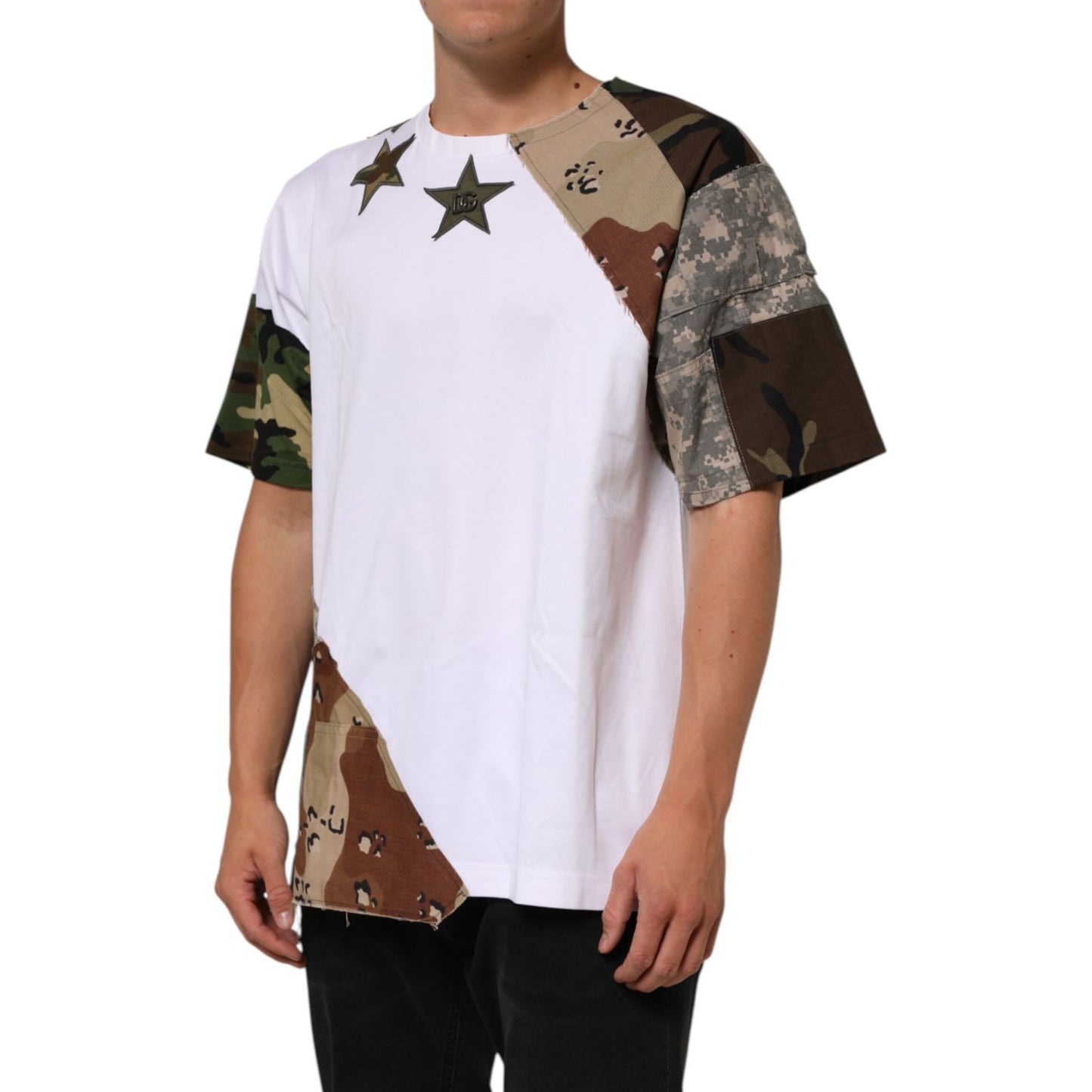 Model wearing Dolce & Gabbana White Camouflage Patckwork Men Cotton T-shirt with star details and camo sleeves.