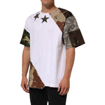 Model wearing Dolce & Gabbana White Camouflage Patckwork Men Cotton T-shirt with star details and camo sleeves.