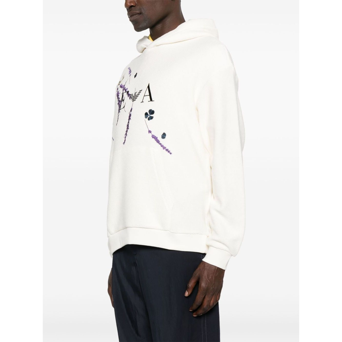 Model wearing EMPORIO ARMANI EXCLUSIVE Sweaters White with hood, front pocket, ribbed cuffs, and printed design.