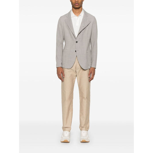 Emporio Armani Jacket with high collar in light grey, featuring front button fastening and side patch pockets; model wearing size 48 IT.