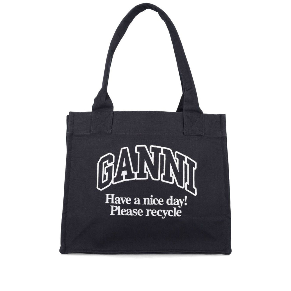 Ganni Organic cotton large tote bag in black with environmental message, featuring two top handles made from 50% organic materials.