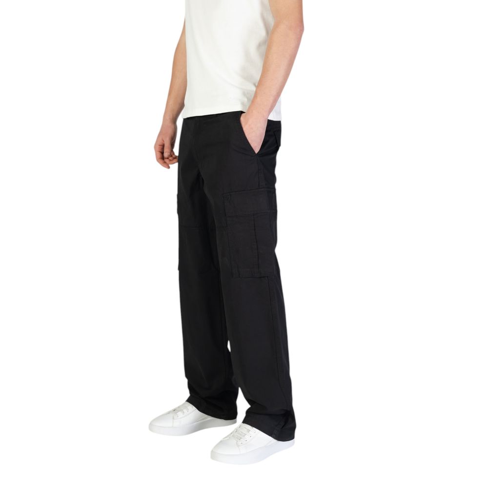 Model wearing Jack Jones Black Cotton Cargo Pants with side flap pockets for versatile style and comfort, regular fit for freedom of movement.