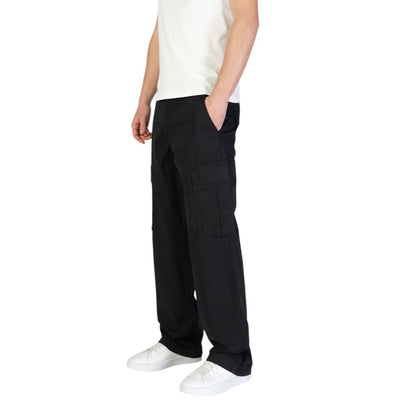 Model wearing Jack Jones Black Cotton Cargo Pants with side flap pockets for versatile style and comfort, regular fit for freedom of movement.