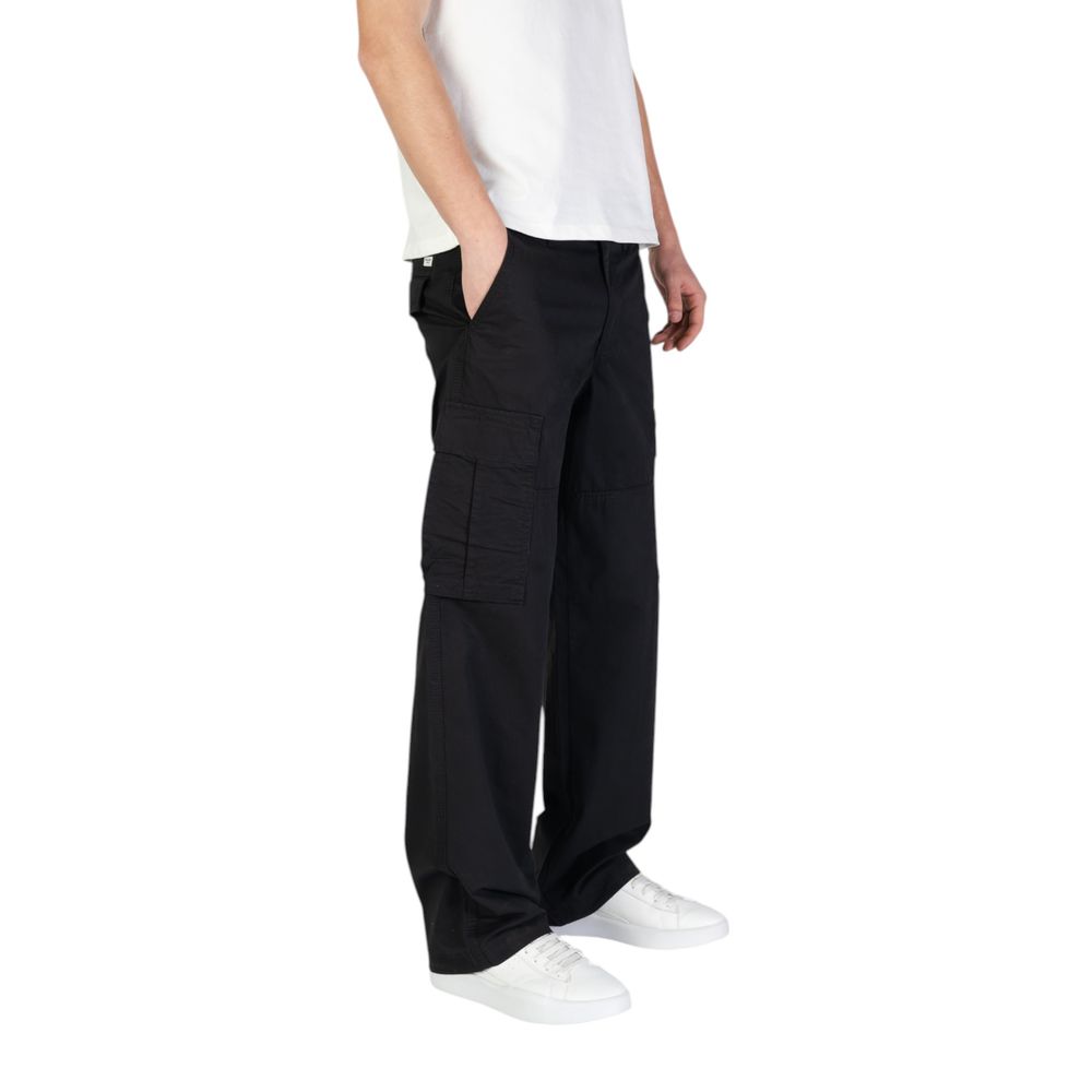 Model wearing Jack Jones Black Cotton Cargo Pants with side flap pockets and a regular fit, showcasing comfort and style.