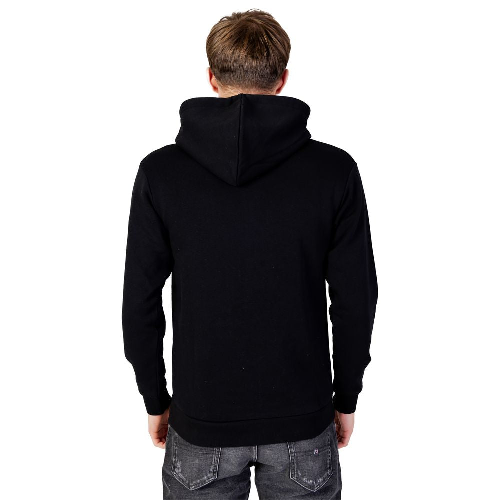 Back view of Jack Jones Black Polyester Hoodie worn by a model, highlighting comfort and style with adjustable drawstring hood and full zip design.