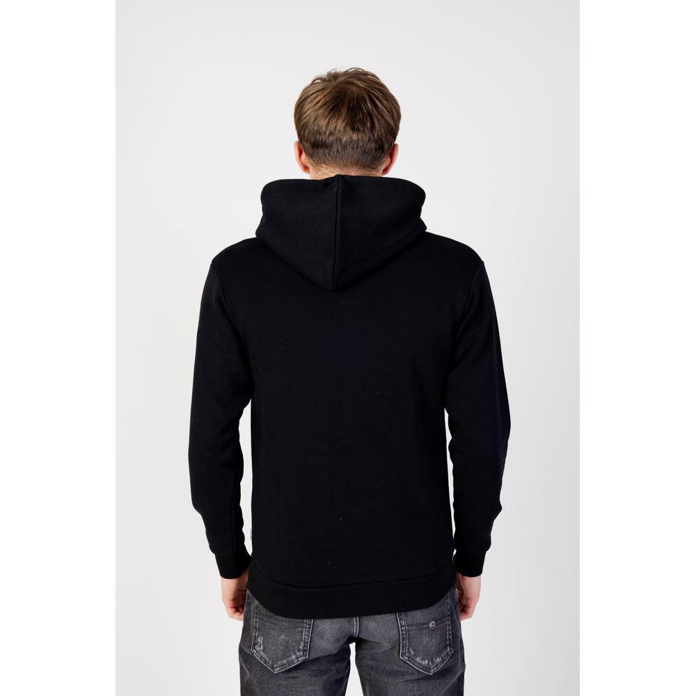 Back view of Jack Jones Black Polyester Hoodie worn by a model, showcasing full zip design and adjustable hood for versatile style.
