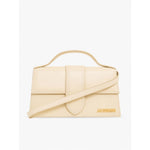 Jacquemus Le Grand Bambino Beige Bag with gold hardware, adjustable strap, and magnetic closure, featuring the Jacquemus logo.