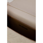 Interior view of Love Moschino Beige Polyethylene Handbag with quilted design and logo, highlighting elegance and quality craftsmanship.