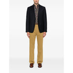 Man wearing Paul Smith Shirts MultiColour floral long sleeve shirt, classic collar under a black blazer and tan trousers, front view