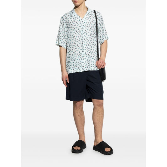 Model wearing Paul Smith Shorts Blue with navy elasticated drawstring waistband and side slit pockets, paired with a patterned shirt.
