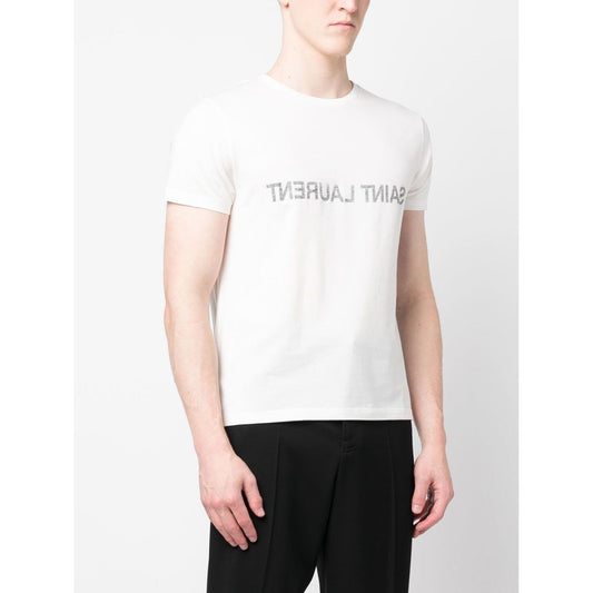 Saint Laurent Logo T-shirt in white cotton with reverse logo print, round neck, and short sleeves worn by model.